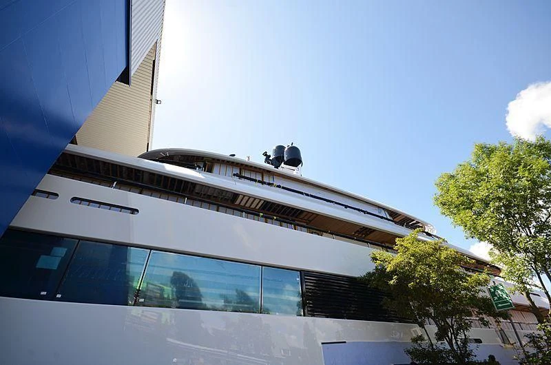 a large white building with a large balcony and a large white boat on top aboard 818 Yacht for Sale