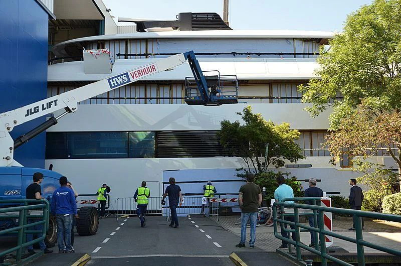 a group of people outside a building aboard 818 Yacht for Sale