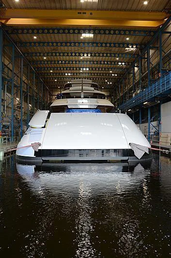 a large white boat in a large building aboard 818 Yacht for Sale