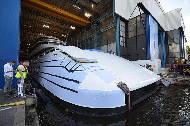 a large white boat in a warehouse aboard 818 Yacht for Sale
