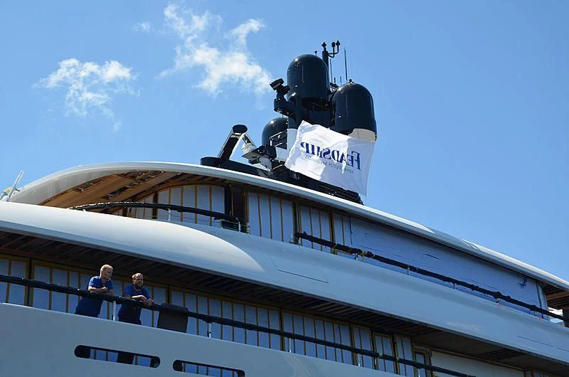 a large cruise ship with a couple of people on the deck aboard 818 Yacht for Sale