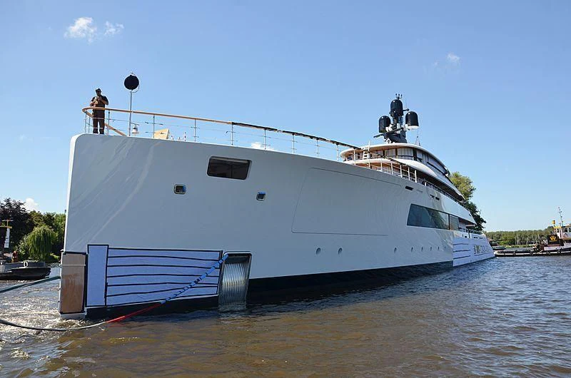 a large white boat in a harbor aboard 818 Yacht for Sale