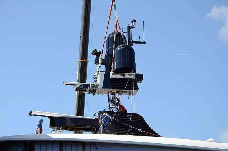 a large boat with a person standing on the deck aboard 818 Yacht for Sale