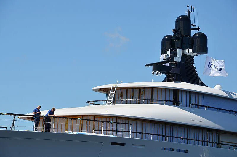 a boat with a satellite dish on the deck aboard 818 Yacht for Sale