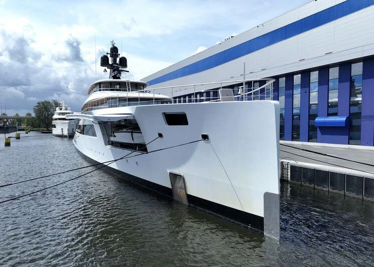a large white boat in a body of water aboard 818 Yacht for Sale