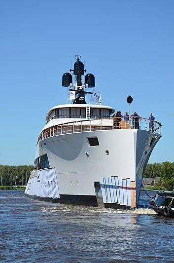 a large white boat with people on it aboard 818 Yacht for Sale