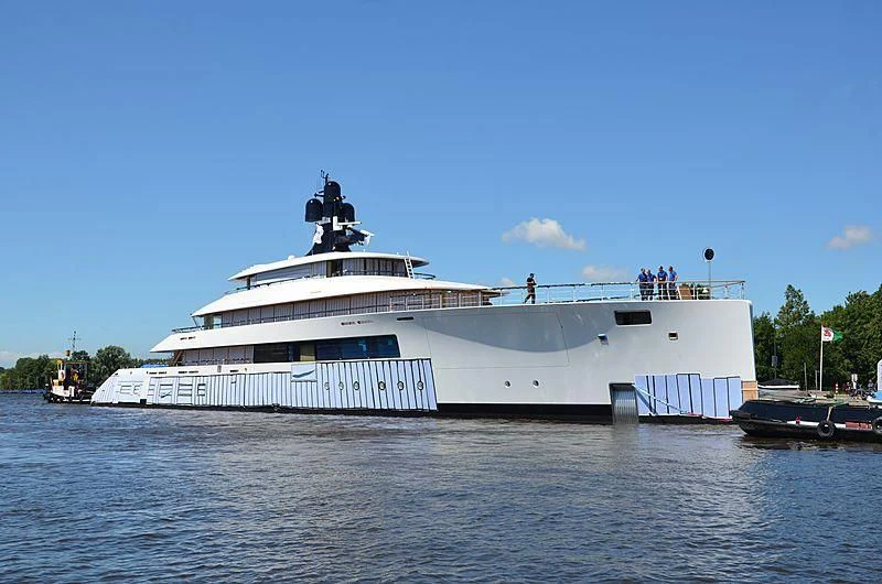 a large white boat with people on it aboard 818 Yacht for Sale