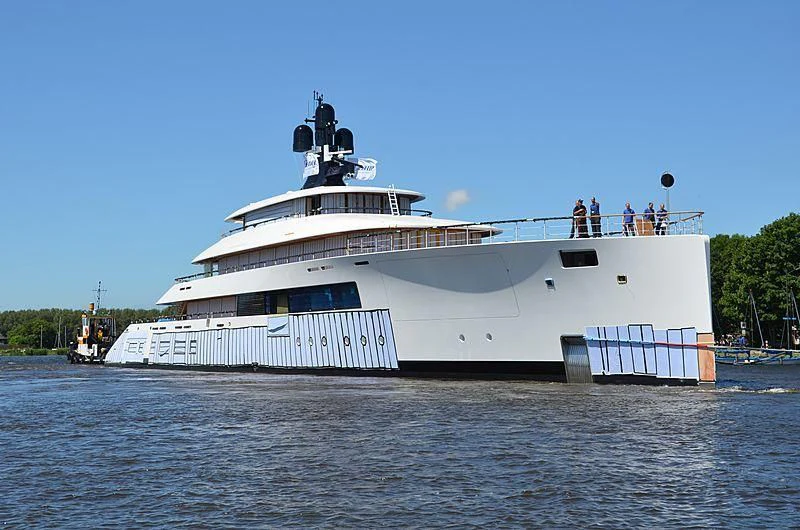 a large white boat with people on it aboard 818 Yacht for Sale