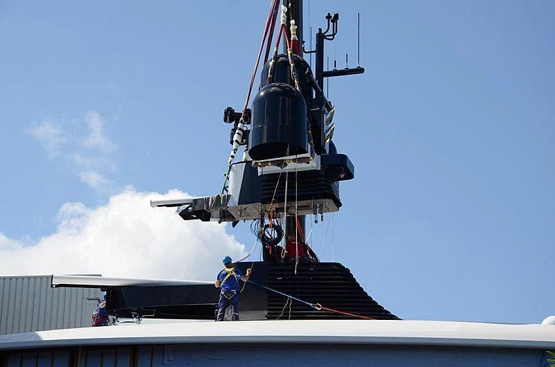 a large boat with a crane aboard 818 Yacht for Sale