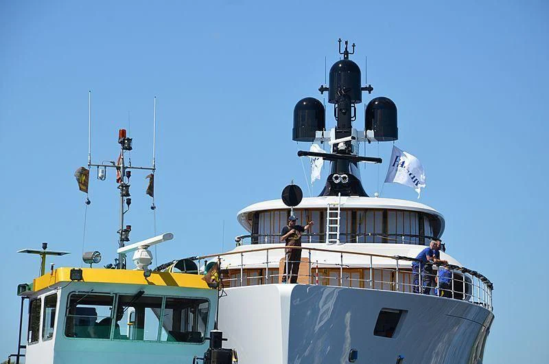 a large white boat with people on it aboard 818 Yacht for Sale