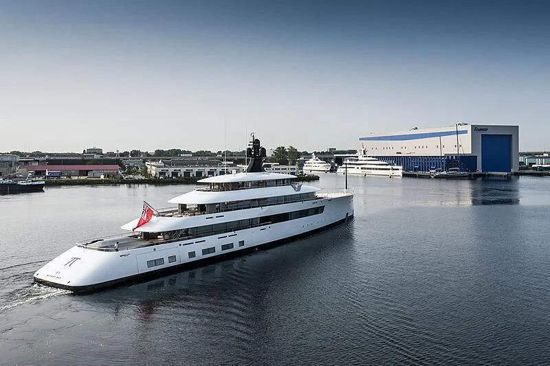 a white yacht in a harbor aboard 818 Yacht for Sale