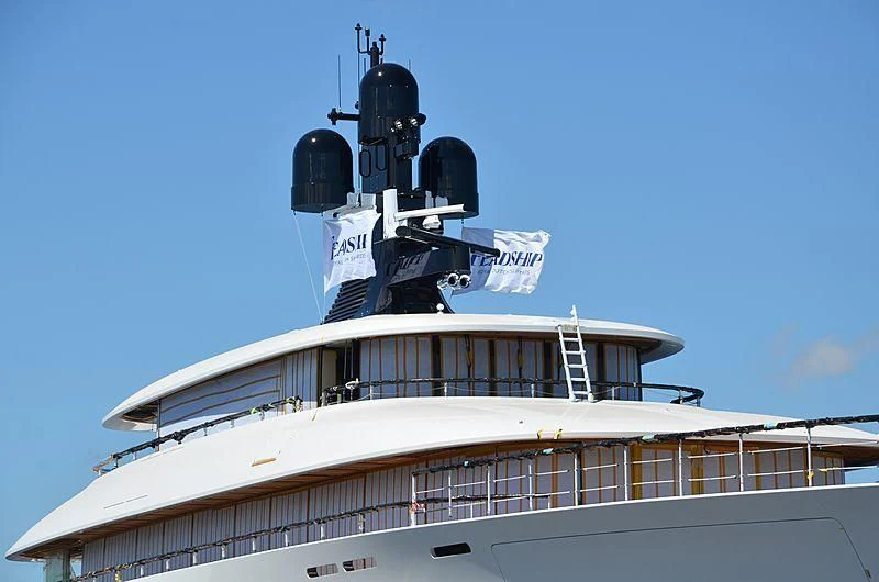 a large white and black helicopter on top of a white building aboard 818 Yacht for Sale