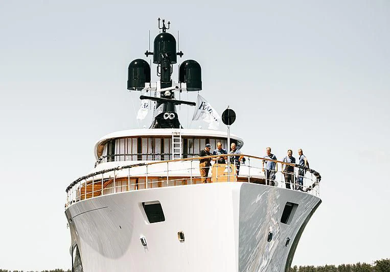 a group of people standing on a ship aboard 818 Yacht for Sale