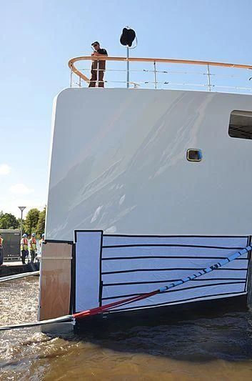 a person on a ladder on a boat aboard 818 Yacht for Sale