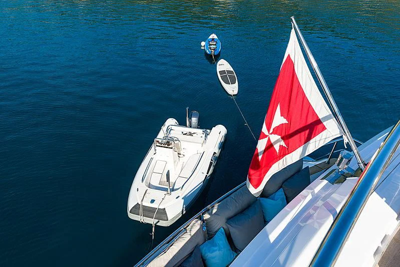 a boat with a flag on it aboard MOONRAKER II Yacht for Sale