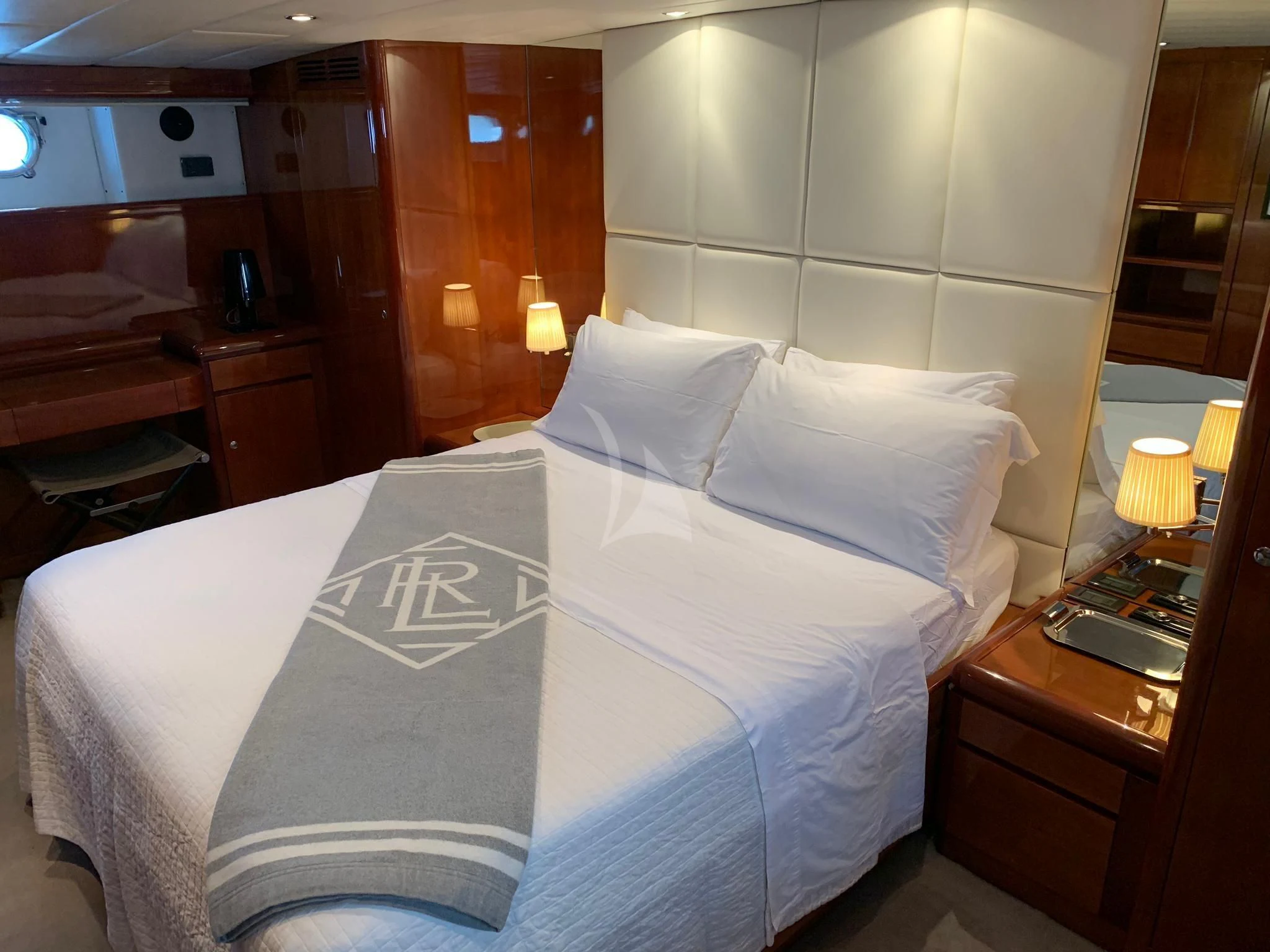 a bed with white sheets aboard MOONRAKER II Yacht for Sale