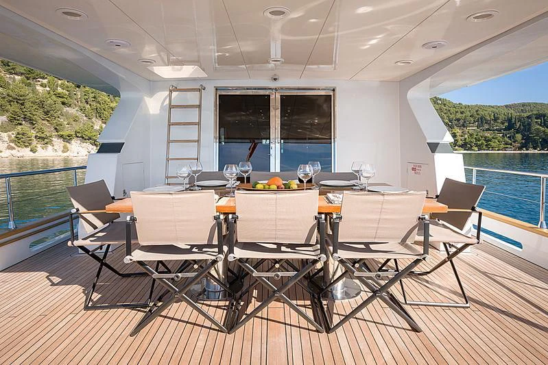 a table set for a meal aboard MOONRAKER II Yacht for Sale