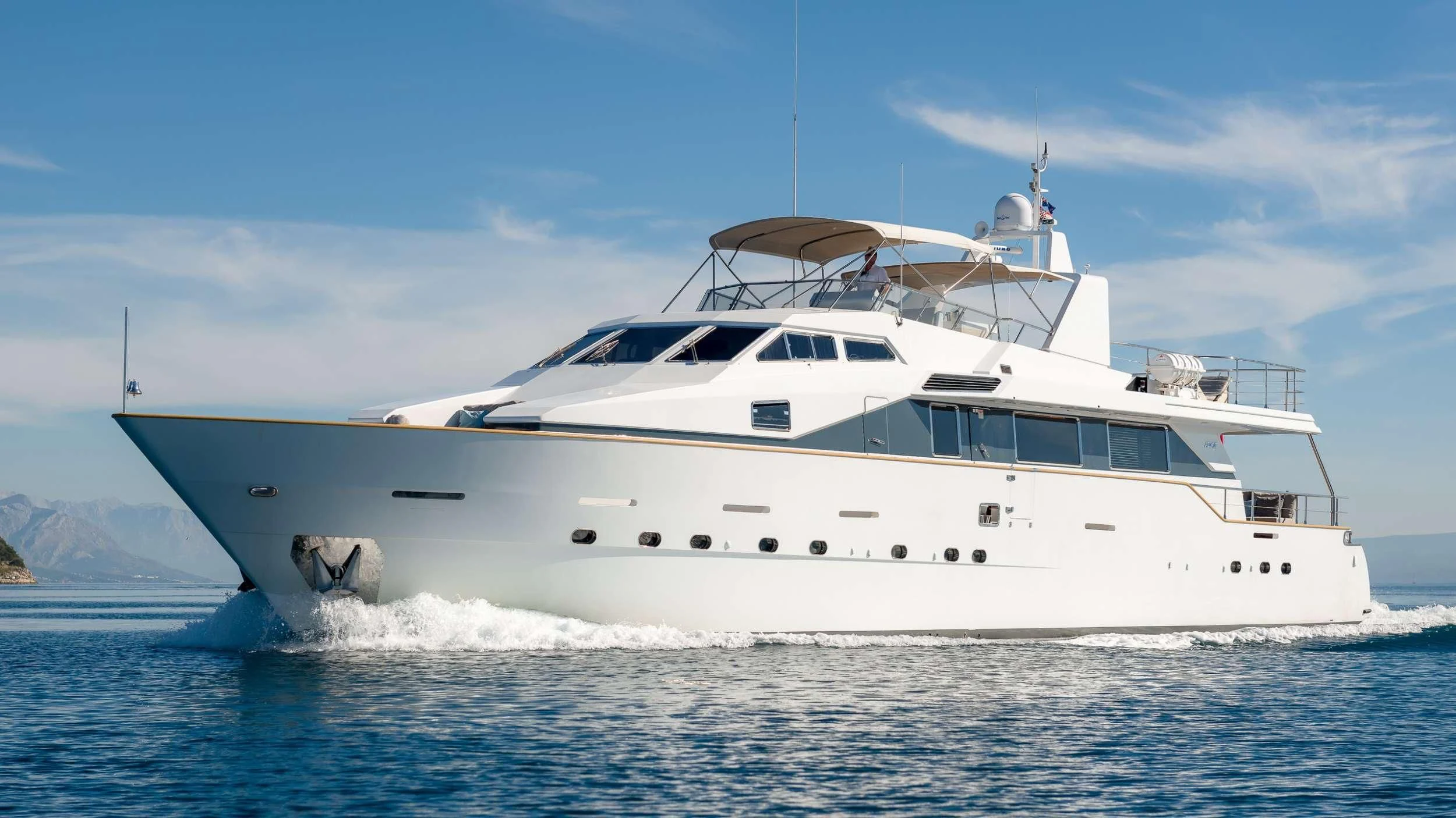 a white yacht on the water aboard MOONRAKER II Yacht for Sale