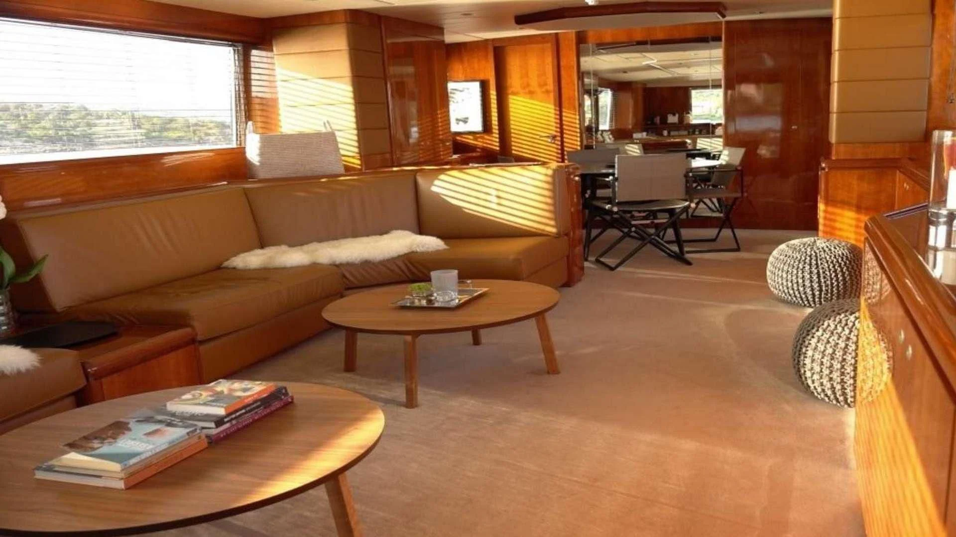 a living room with a couch and coffee table aboard MOONRAKER II Yacht for Sale