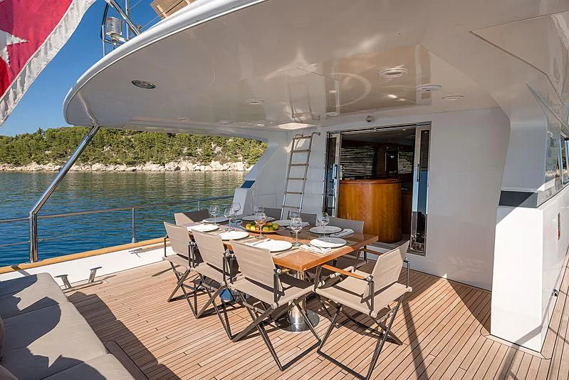 a dining table on a boat aboard MOONRAKER II Yacht for Sale