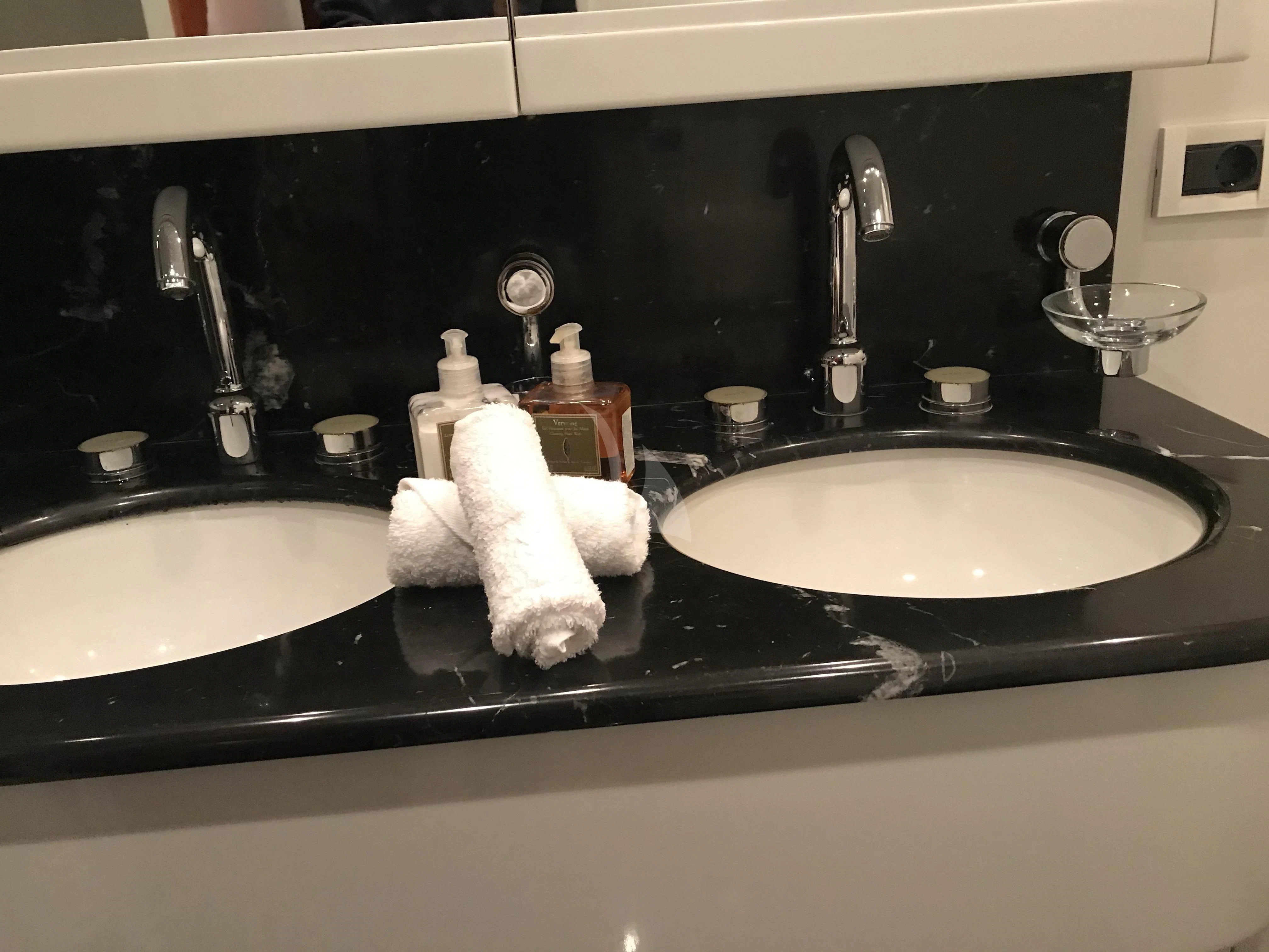 a sink with a couple of soap bottles on it aboard MOONRAKER II Yacht for Sale