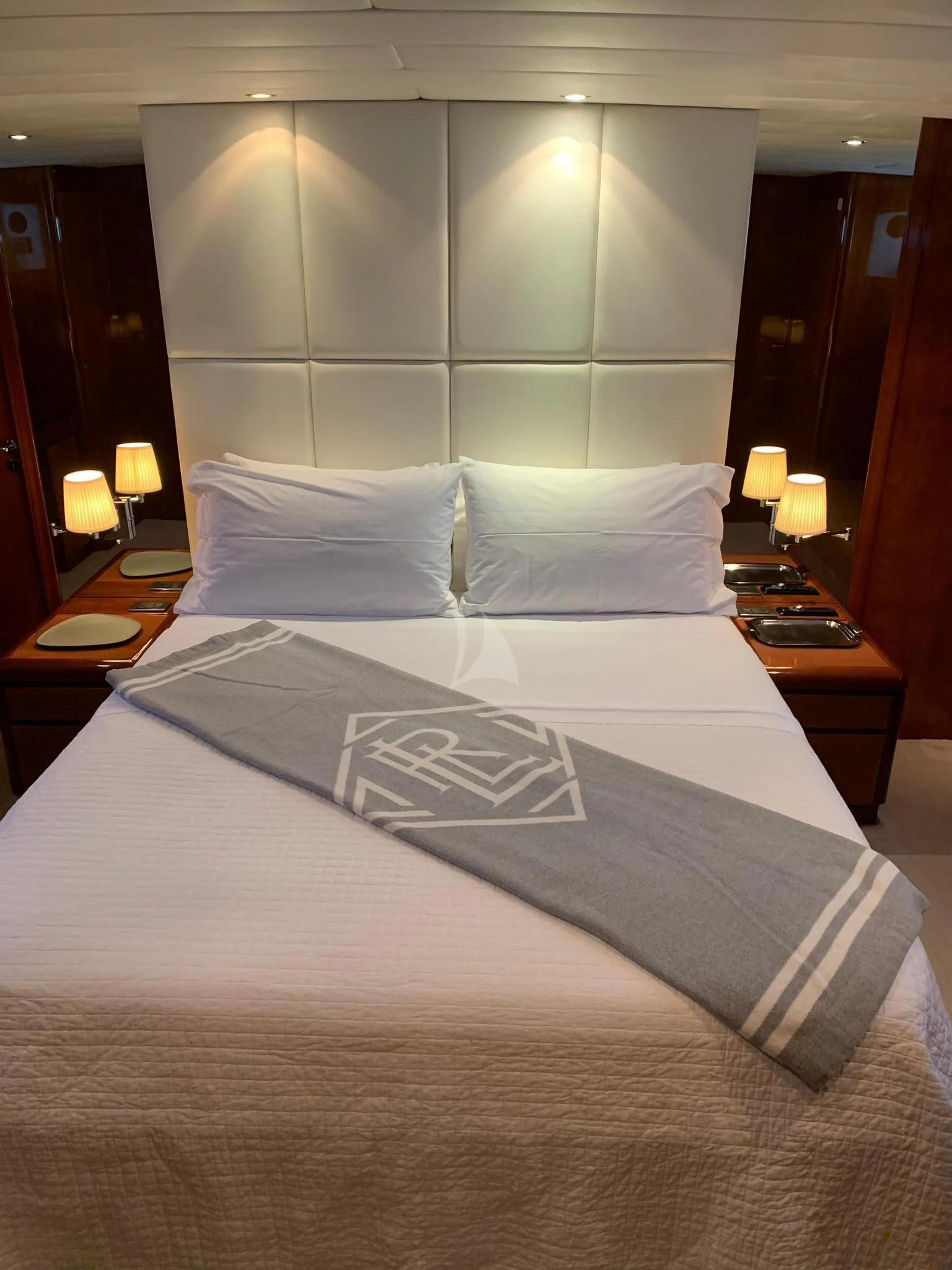 a bed with white sheets aboard MOONRAKER II Yacht for Sale