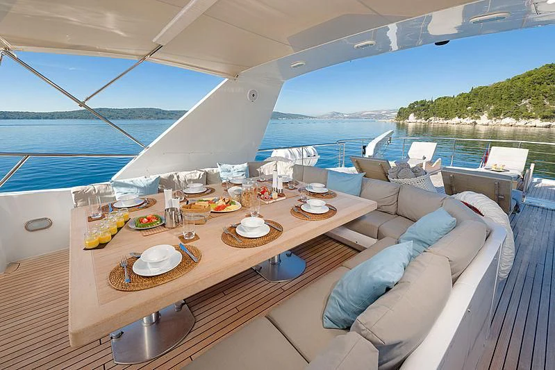 a boat with a table and chairs aboard MOONRAKER II Yacht for Sale