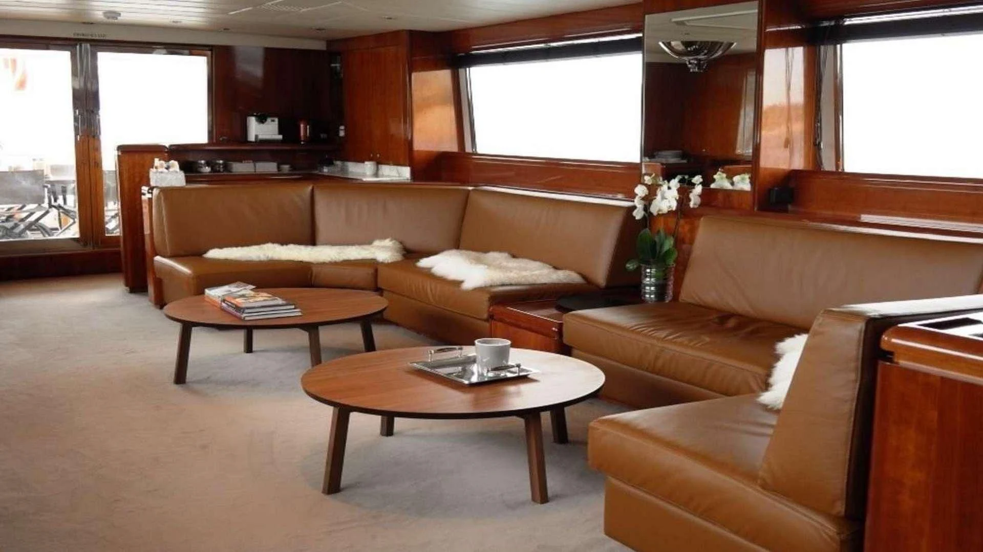 a living room with a couch and coffee table aboard MOONRAKER II Yacht for Sale