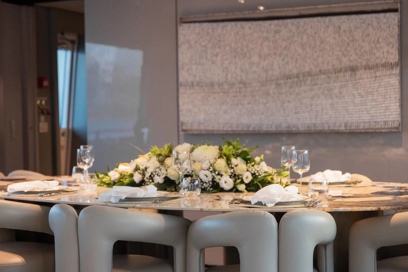 a table with plates and glasses aboard FAMILIA Yacht for Sale