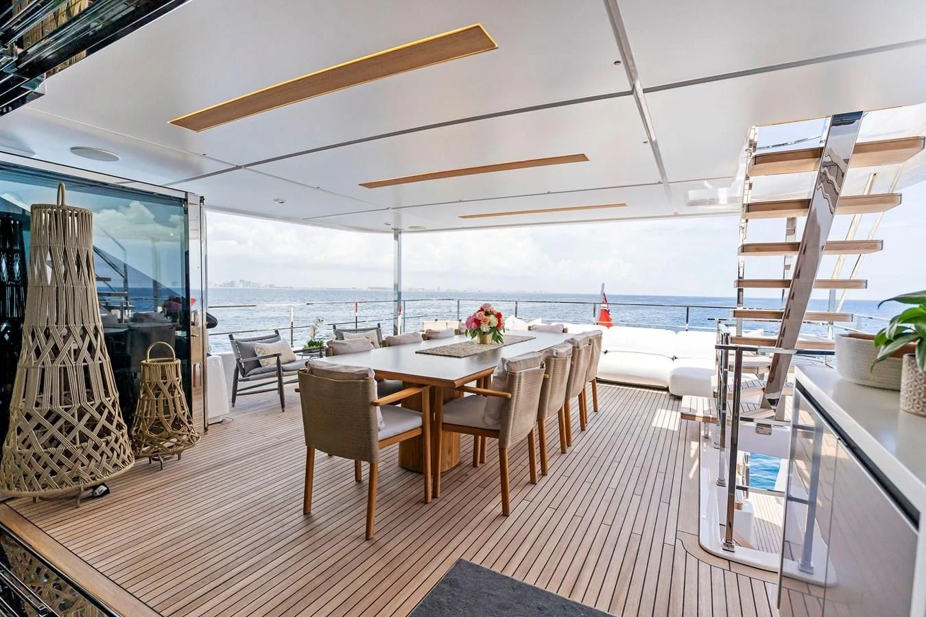 a room with a table and chairs aboard FAMILIA Yacht for Sale