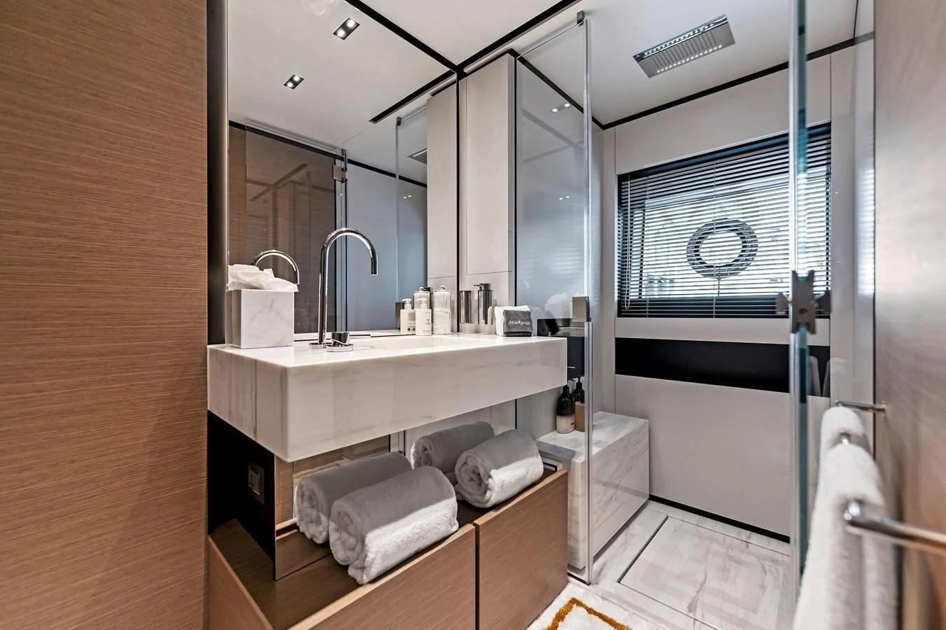 a bathroom with a sink and a mirror aboard FAMILIA Yacht for Sale