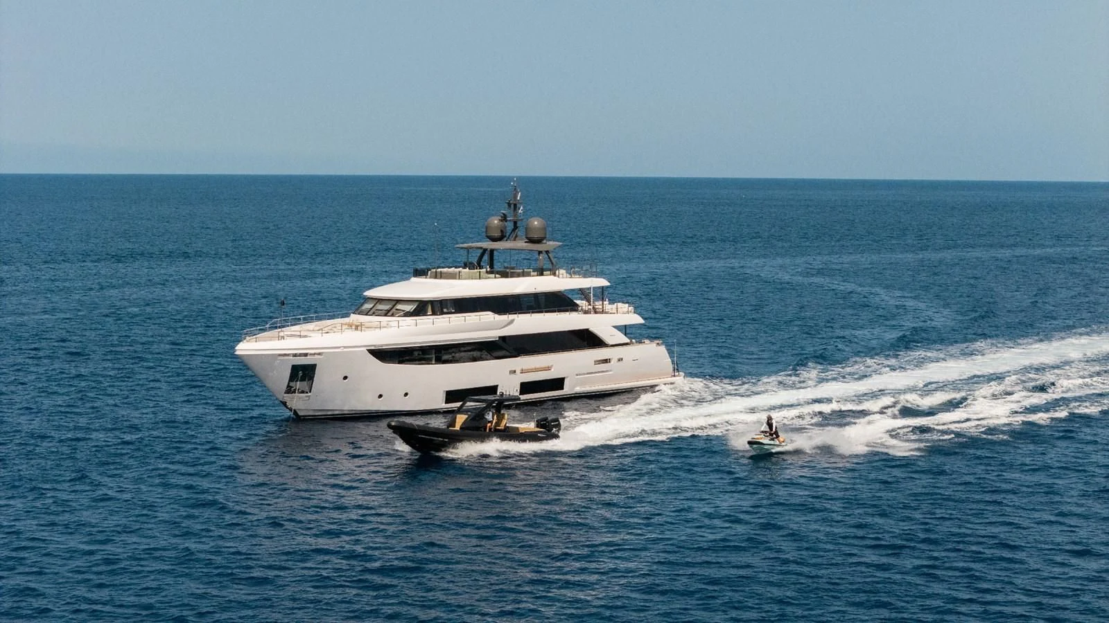 a boat and a person in the water aboard FAMILIA Yacht for Sale