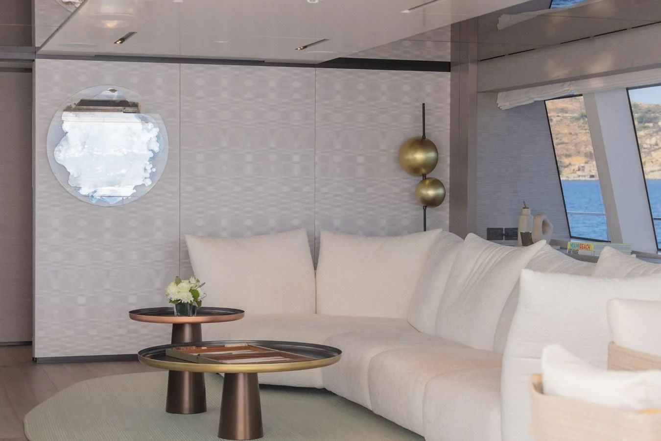 a room with a couch and a table aboard FAMILIA Yacht for Sale