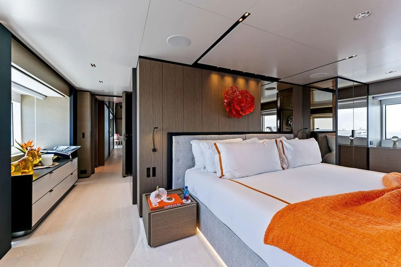a bedroom with a bed and a desk aboard FAMILIA Yacht for Sale