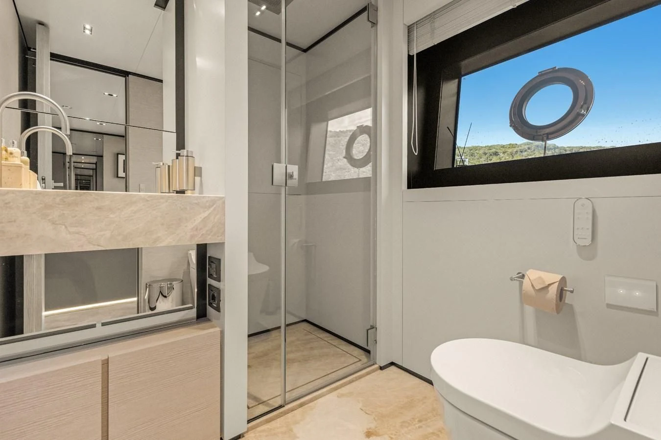 a bathroom with a glass shower aboard FAMILIA Yacht for Sale