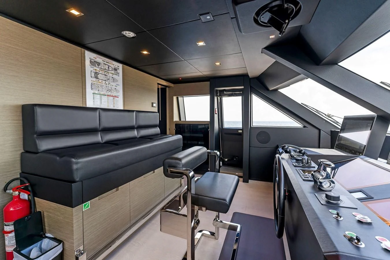 a room with a couch and a desk aboard FAMILIA Yacht for Sale