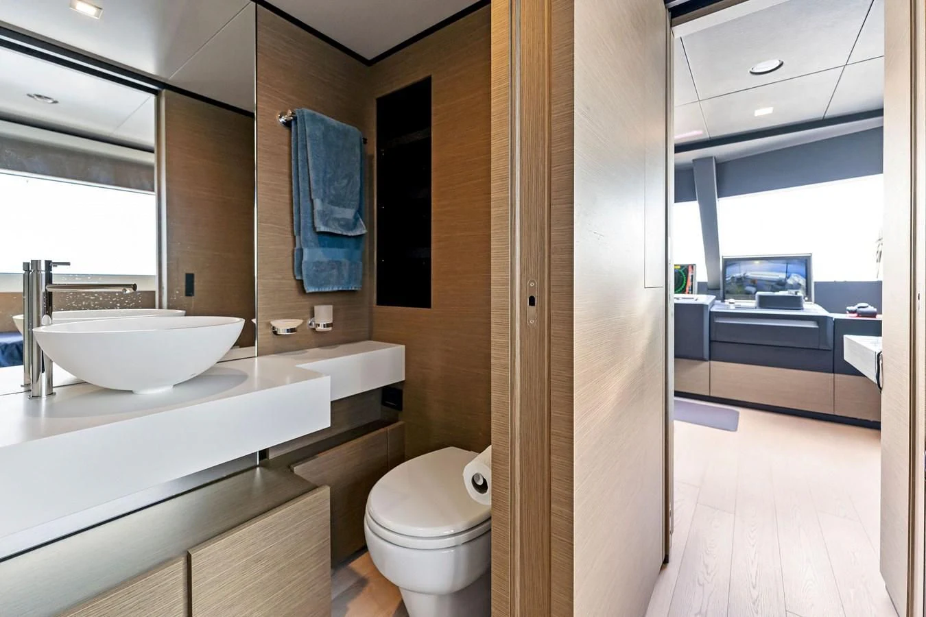 a bathroom with a sink and a toilet aboard FAMILIA Yacht for Sale