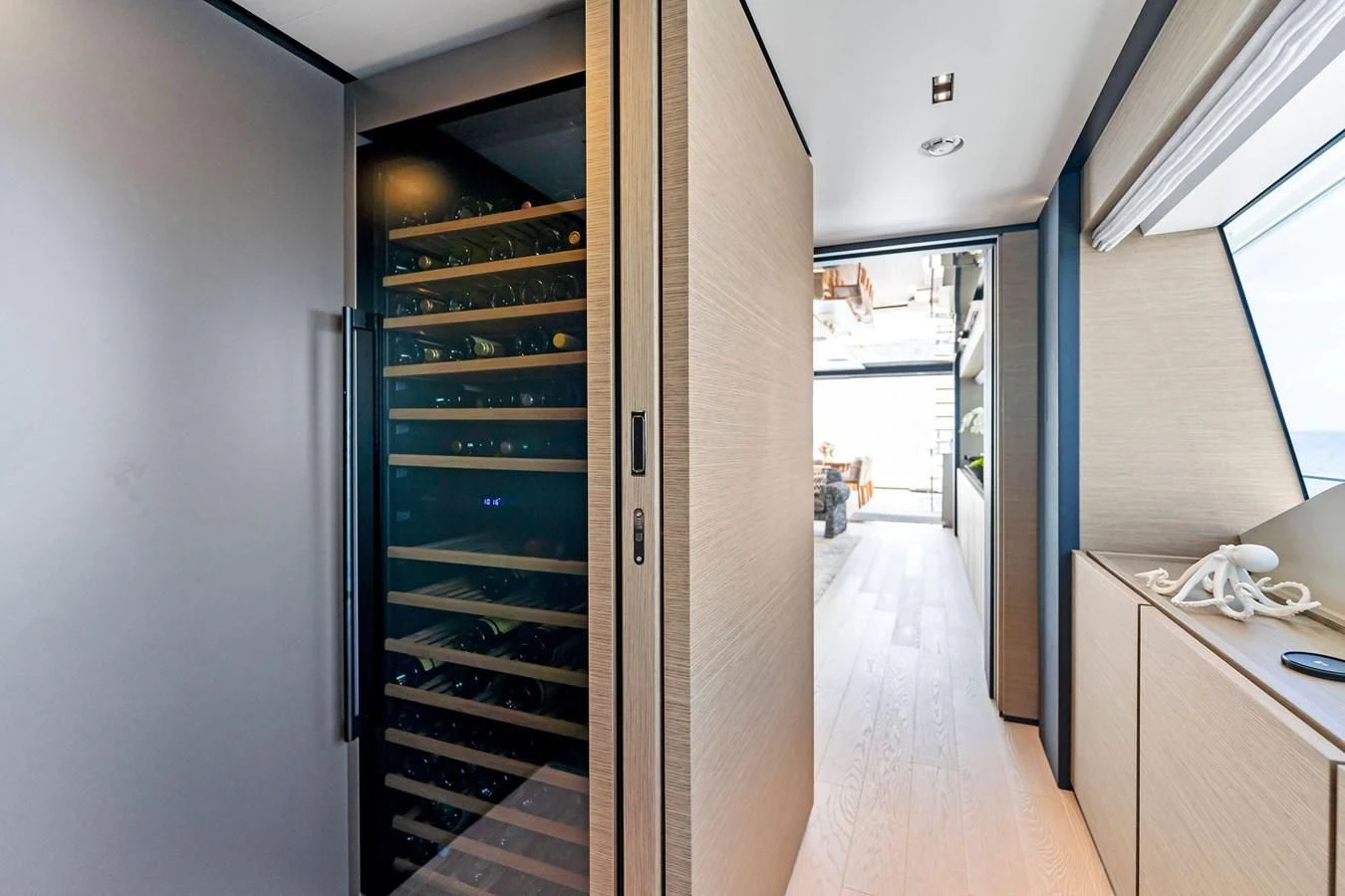 a hallway with a door and a desk aboard FAMILIA Yacht for Sale