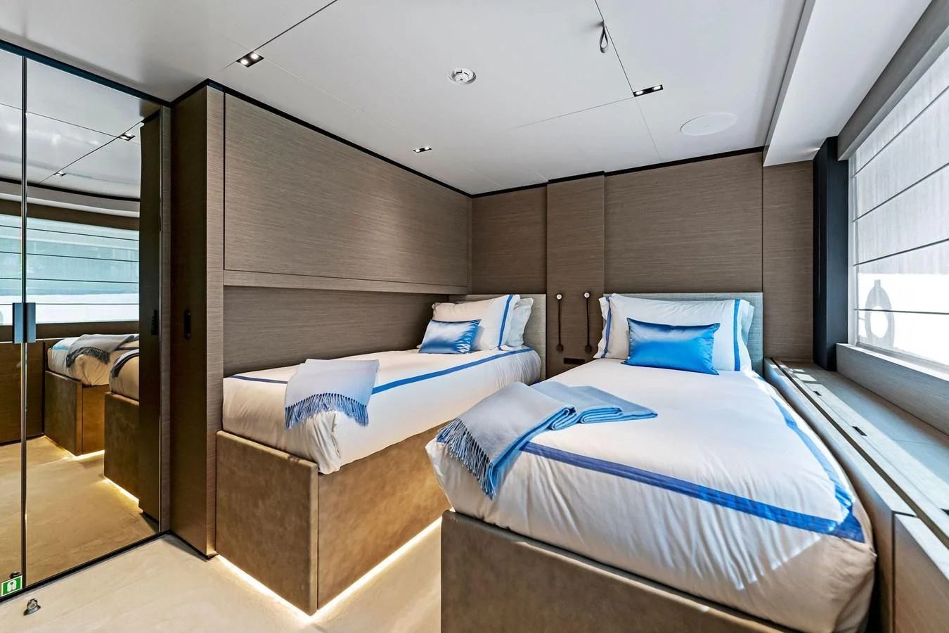 a couple of beds in a room aboard FAMILIA Yacht for Sale