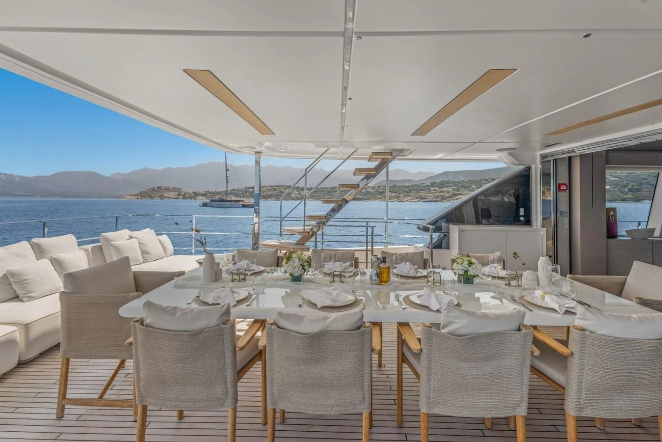 a table set for a meal aboard FAMILIA Yacht for Sale
