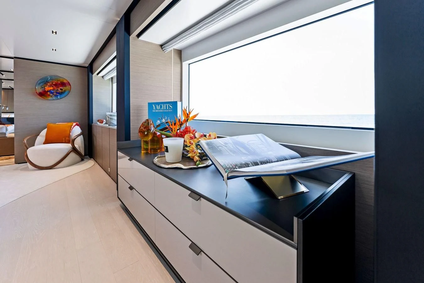 a room with a bed and a desk aboard FAMILIA Yacht for Sale