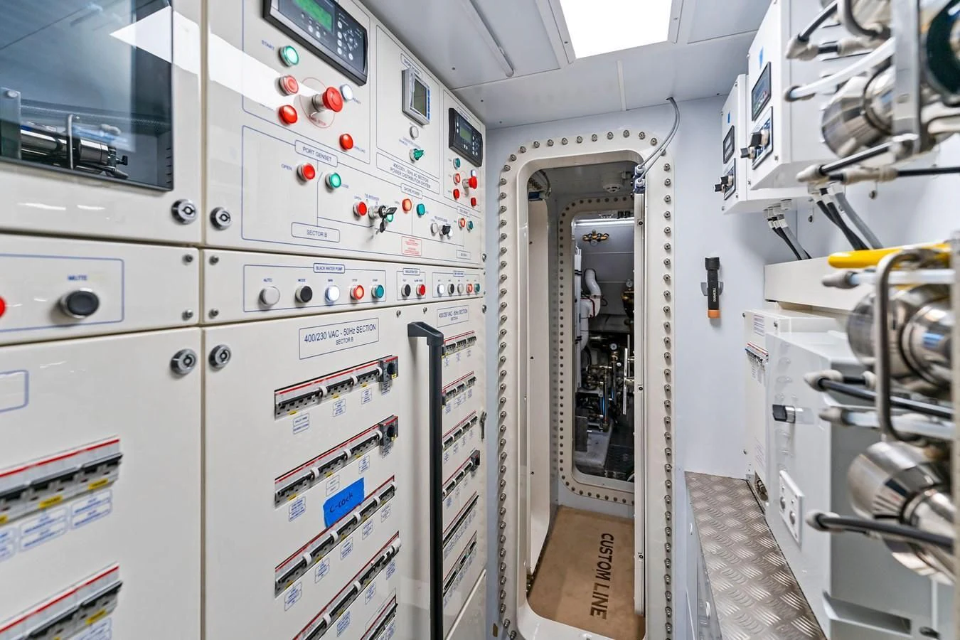 a room with white machines aboard FAMILIA Yacht for Sale