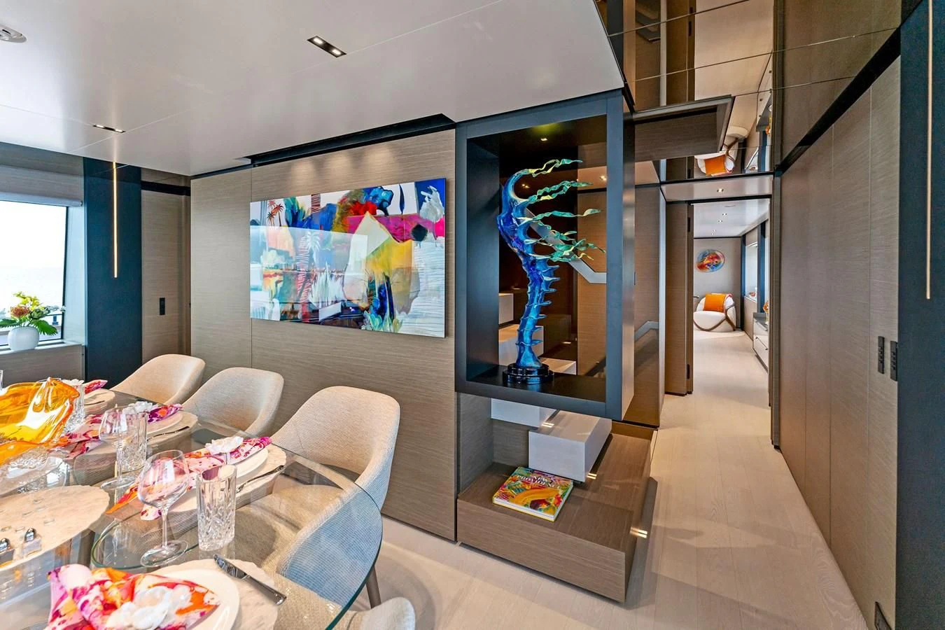 a room with a table and chairs aboard FAMILIA Yacht for Sale