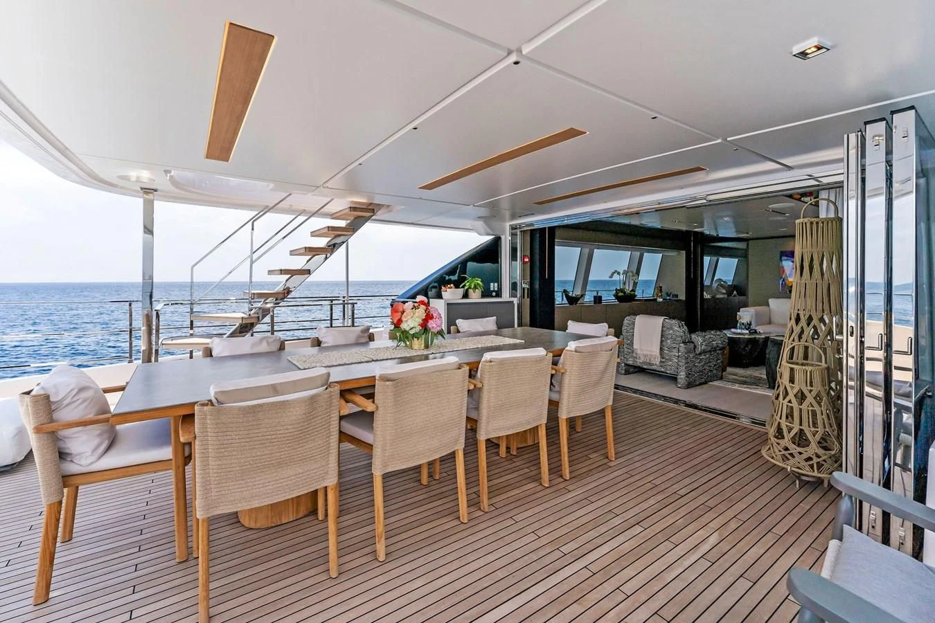 a large dining table on a boat aboard FAMILIA Yacht for Sale