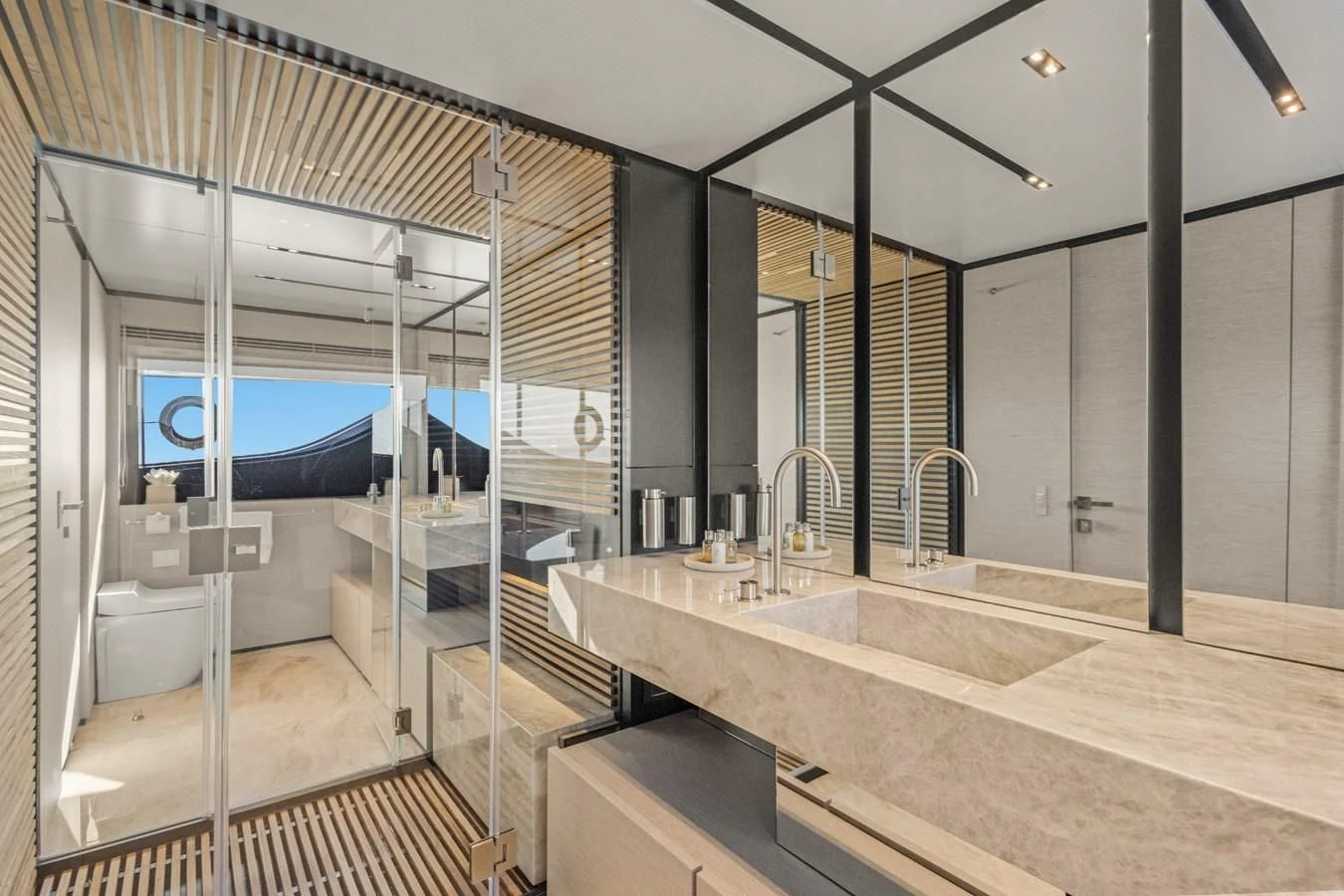 a bathroom with a large mirror aboard FAMILIA Yacht for Sale