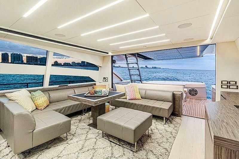 a living room with a large window aboard SUGAR Yacht for Sale