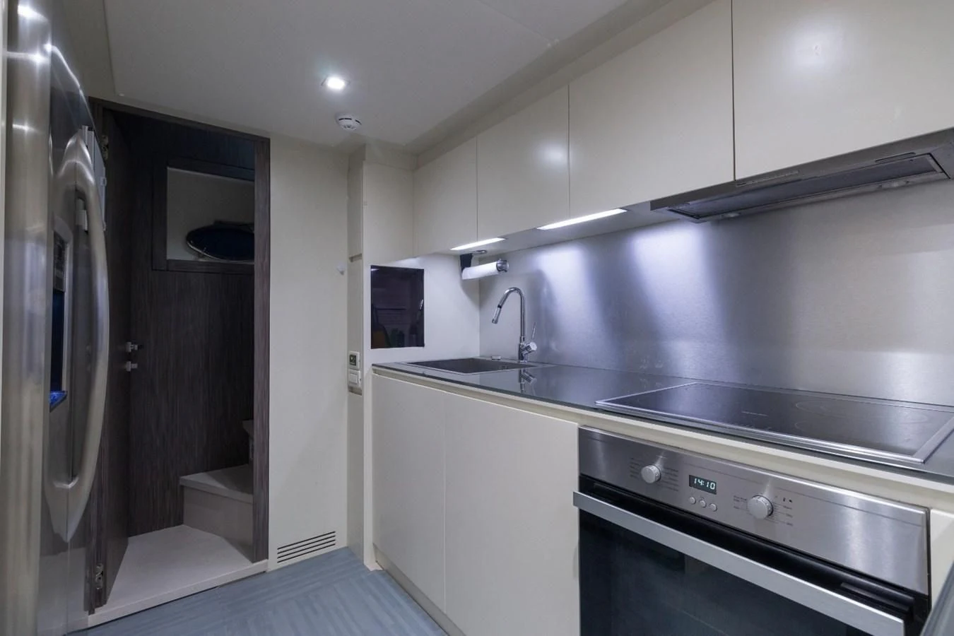 a kitchen with a sink and cabinets aboard SUGAR Yacht for Sale
