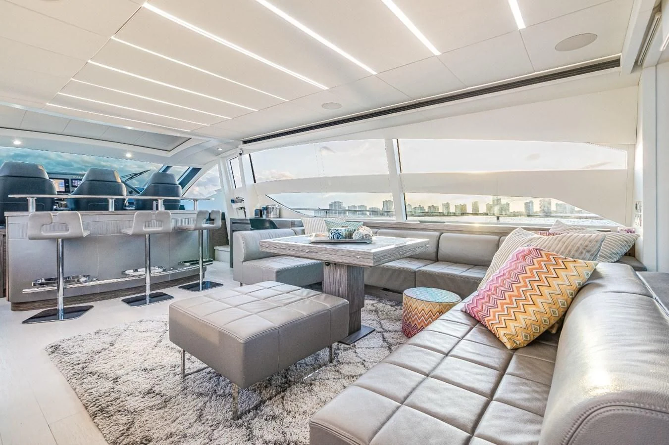 a room with a couch and a table aboard SUGAR Yacht for Sale