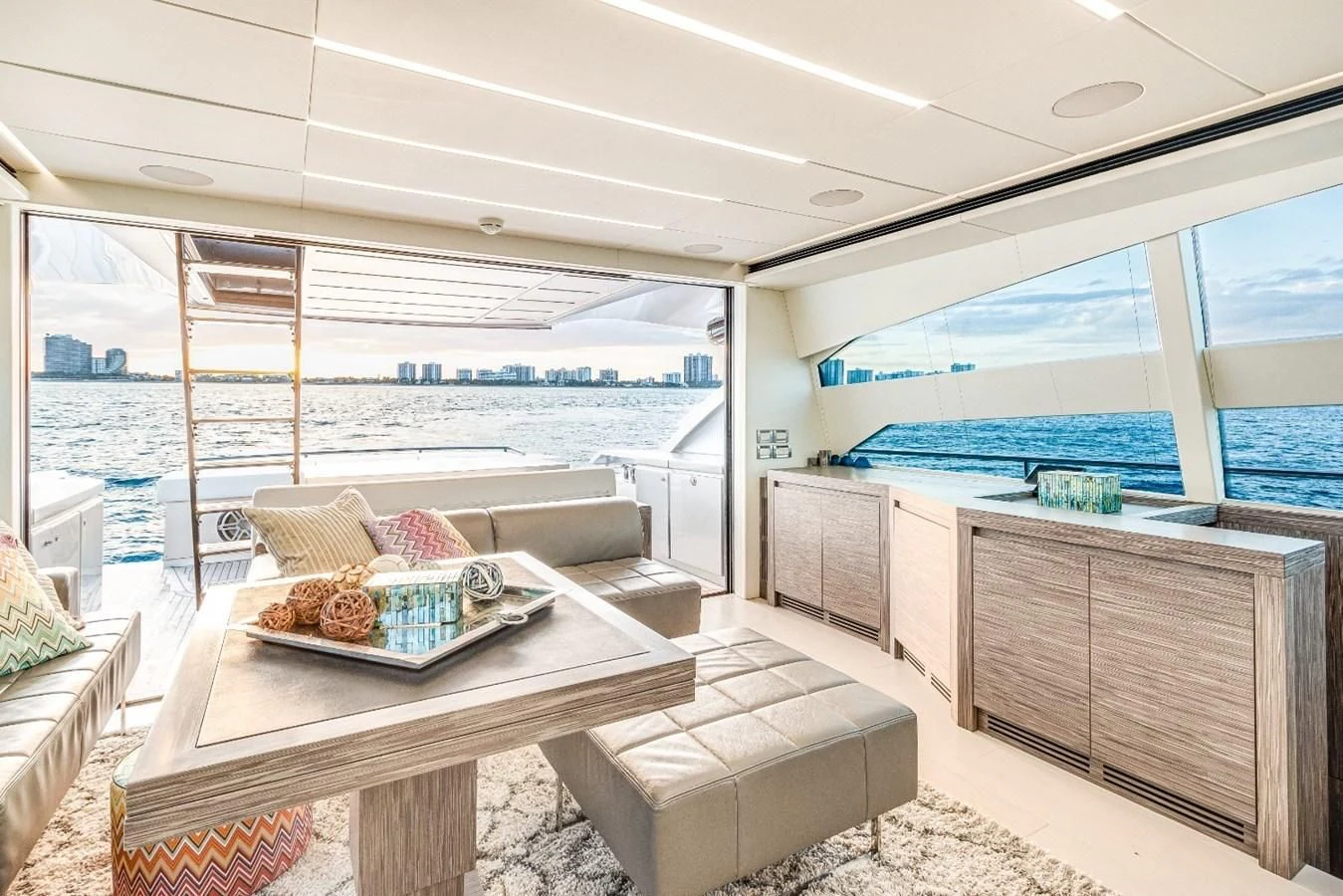 a living room with a large window aboard SUGAR Yacht for Sale