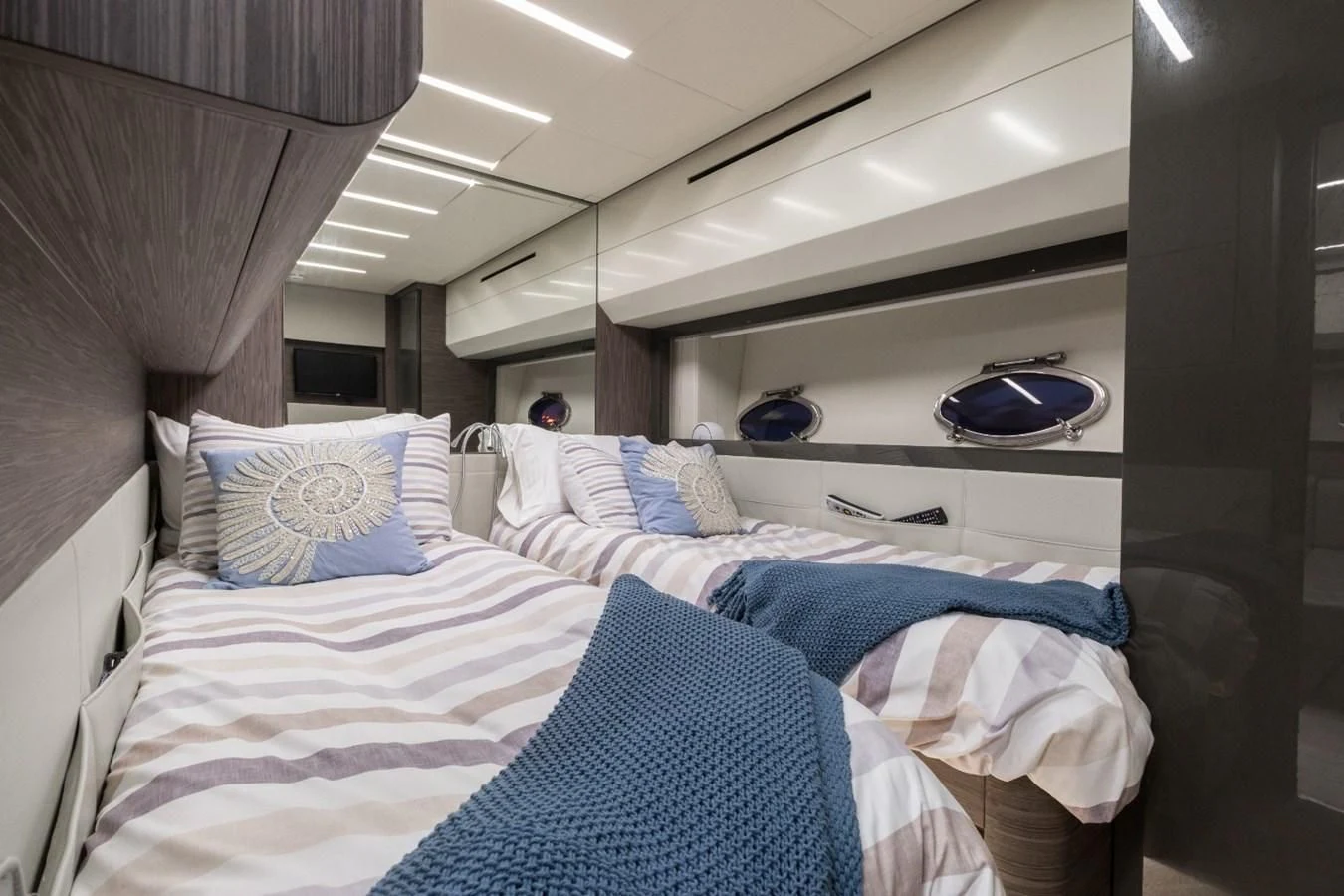 a person lying on a bed aboard SUGAR Yacht for Sale